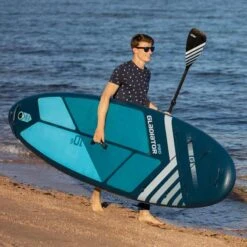 Gladiator Pro 10'6 X 32" Paddleboard 2023 -Surfing Equipment Shop gladiator 10 6 on beach male model 2
