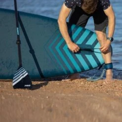 Gladiator Pro 10'6 X 32" Paddleboard 2023 -Surfing Equipment Shop gladiator 10 6 on beach male model fin room fortext