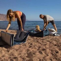 Gladiator Origin 10'4 X 30" Paddleboard 2023 18 Gladiator Origin 10'4 X 30" Paddleboard 2023 -Surfing Equipment Shop gladiator 10 8 origin unrolling on beach