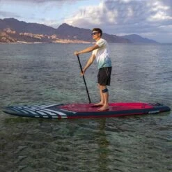 Gladiator Pro T 12'6 X 32" Paddleboard 2023 -Surfing Equipment Shop gladiator 12 6 pro man on sea side 1