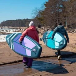 Gladiator Pro 11'2 X 30" Paddleboard 2023 -Surfing Equipment Shop sq 11 2 10 6 walking on beach with board